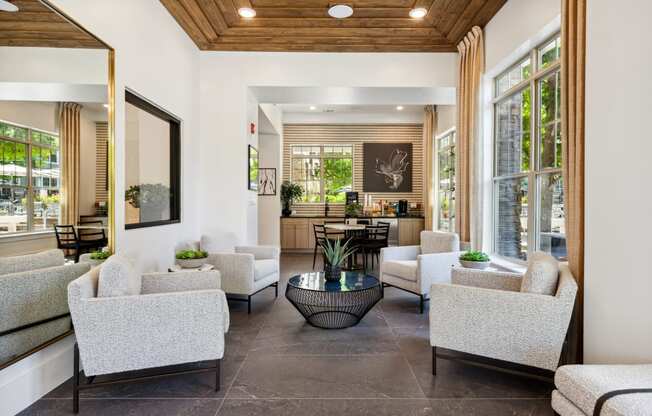 a living room filled with furniture and a large window