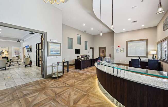 a lobby with a reception desk and a large window