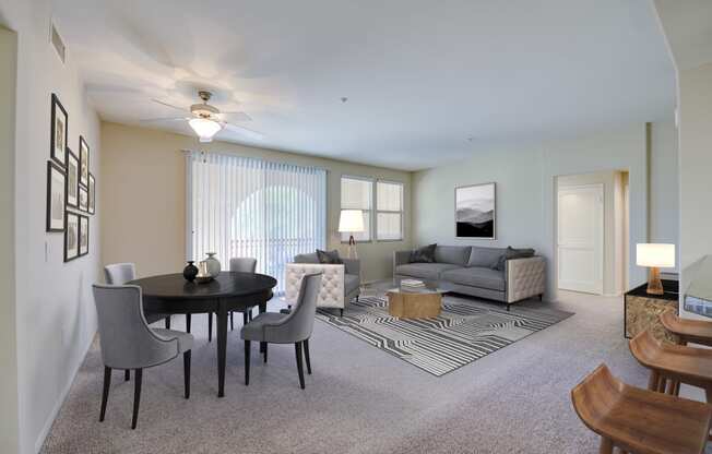 a living room with a table and chairs and a couch