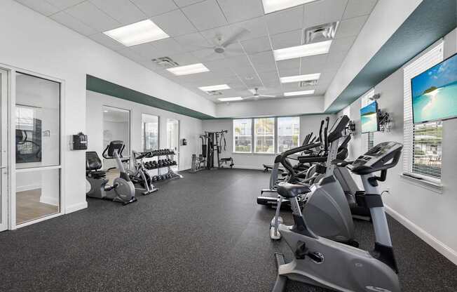 A spacious gym with a variety of exercise equipment.