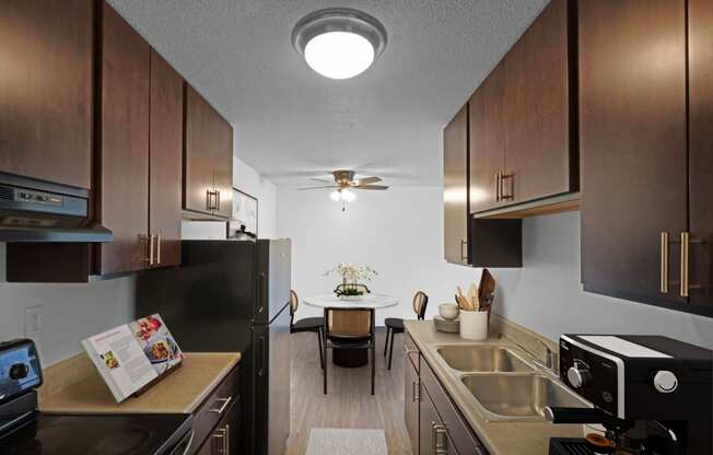 a kitchen and dining area in a 555 waverly unit