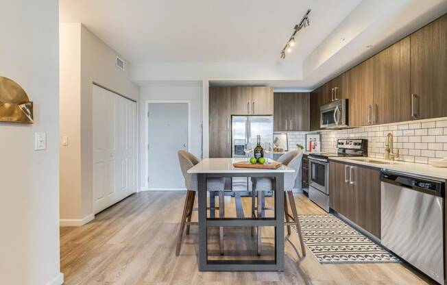 an open kitchen and dining room with a table and chairs