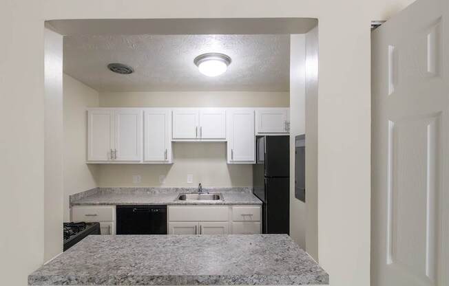 This is a photo of the kitchen pass through window in the 543 square foot A-style, 1 bedroom, 1 bath apartment at Blue Grass Manor Apartments in Erlanger, KY.
