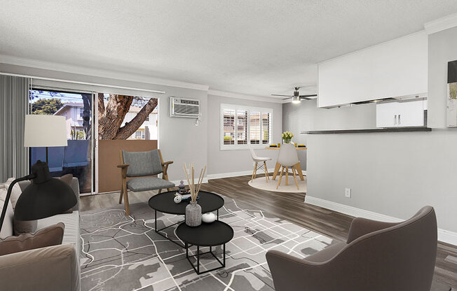 Hardwood floored living room with view of dining area.