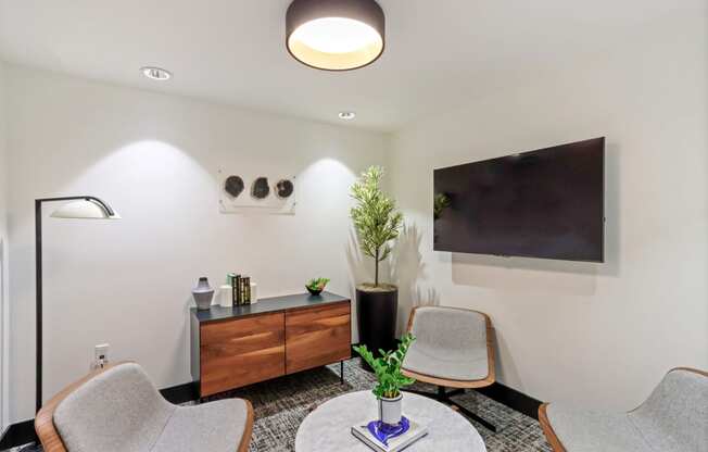 Room with a table and chairs and a flat screen tv on the wall at Array La Mesa, La Mesa, 91942