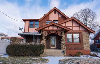 Beautifully updated Tudor style duplex. Upper unit. Large rooms. 2 balconies, private entry. Fenced in Yard with Garage.