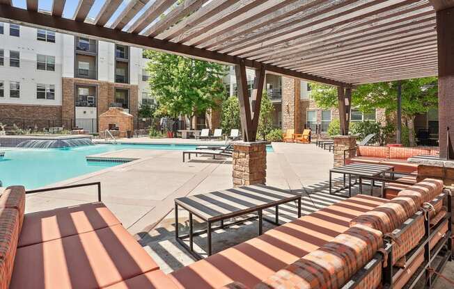 our apartments have a resort style pool and lounge furniture