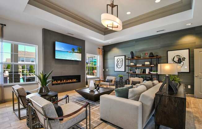 a living room with couches and chairs and a fireplace