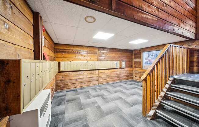 A wooden staircase with a wood railing.