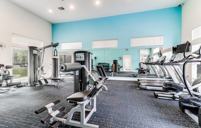 A spacious gym with a variety of equipment including treadmills, weight machines, and free weights, Plantation Crossing, Lafayette, LA, 70508