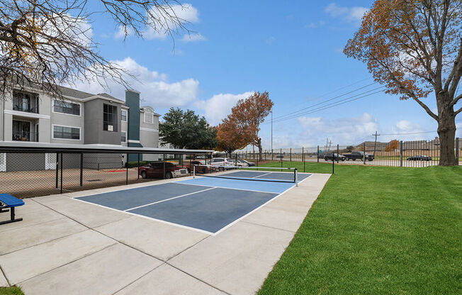 Community Sports Court with Nets at Bridges at Oakbend Apartments in Lewisville, TX.