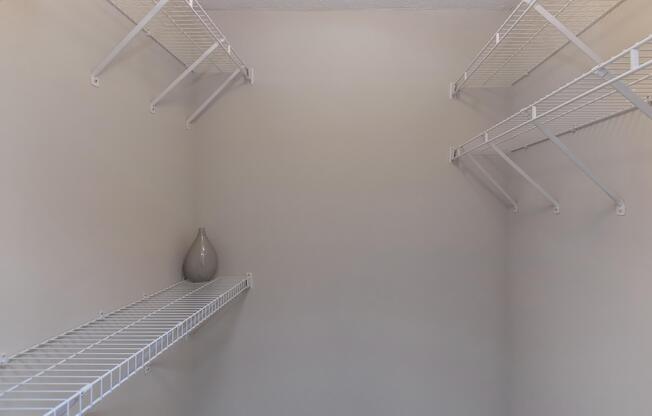 Closet interior with wire rack shelving at Ashley Oaks Apartments in Greensboro, North Carolina