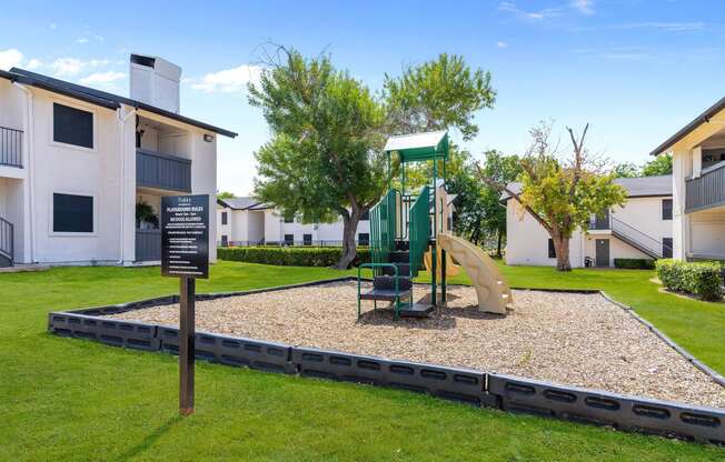 a playground at the whispering winds apartments in pearland, tx