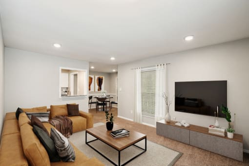 a living room with a couch and a coffee table in front of a flat screen tv at Lake Johnson Mews, Raleigh, NC, 27606