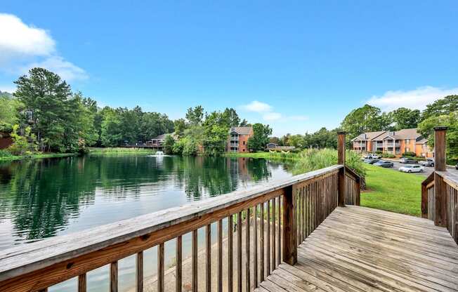 a view of a body of water from a wooden deck