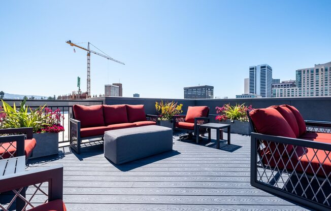 Uptown Oakland Apartments - Rowhaus Apartments - Rooftop Lounge Seating Area with City Skyline Views