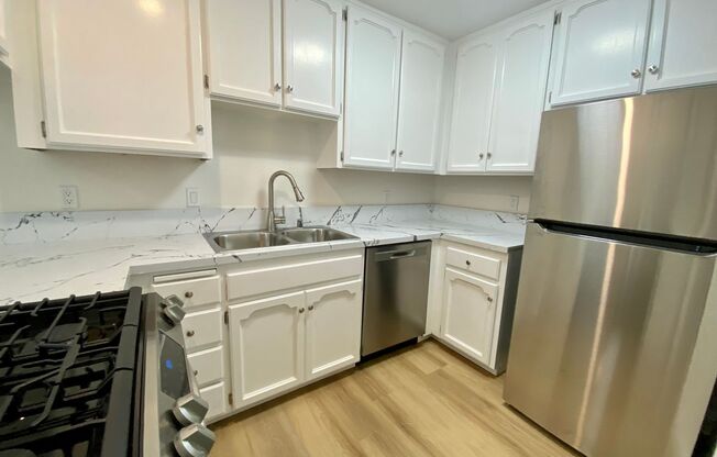 BLOCKS from the BEACH and Bay! Spacious 3 Bedroom in PB! Garage Storage! On Site Laundry!