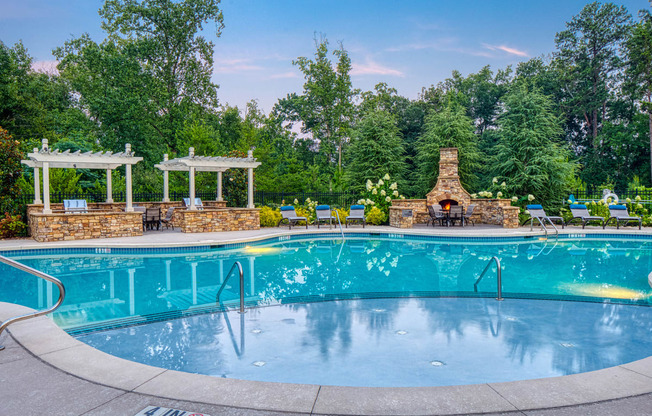 The Oaks at Johns Creek - Saltwater swimming pool with BBQ grills and fireplace social area