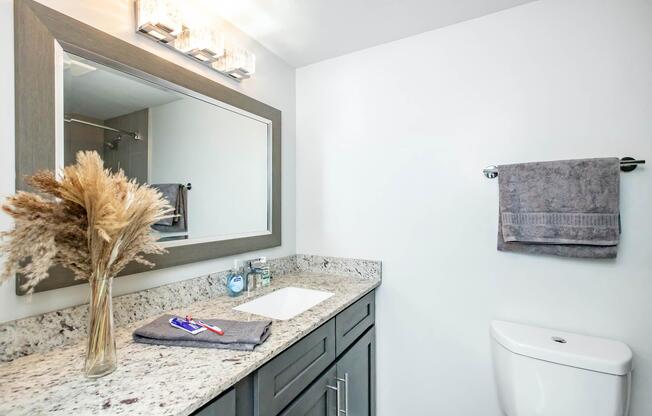 a kitchen with a sink and a mirror