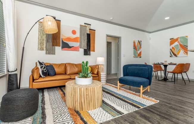 a living room with a couch and a chair and a table