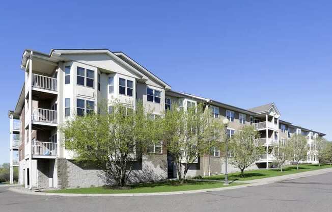 Apartment building with a clear blue sky above.