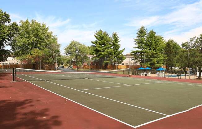 private tennis court at apartment community