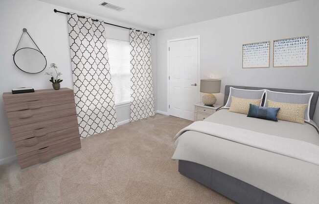 a bedroom with a bed and a dresser and a window