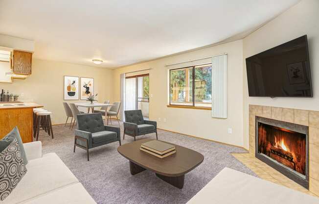 a living room with a fireplace and a tv