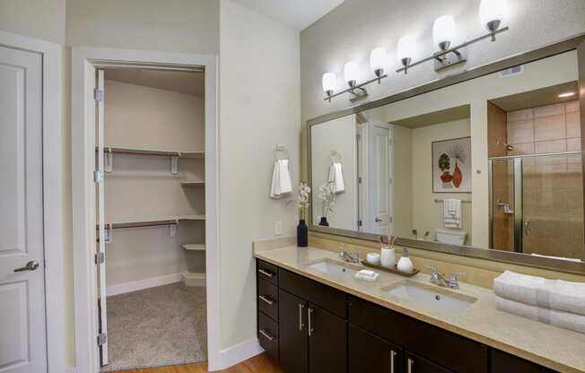 a bathroom with a large mirror and a sink
