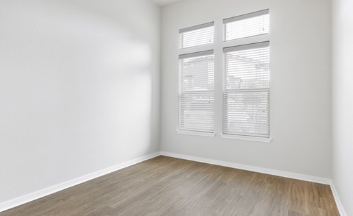 Renovated bedroom with wood style flooring