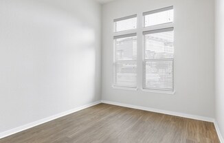 Renovated bedroom with wood style flooring