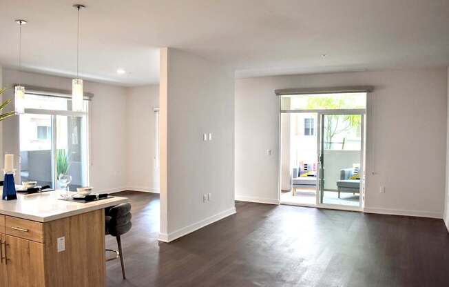 A kitchen with a dining table and chairs is shown.