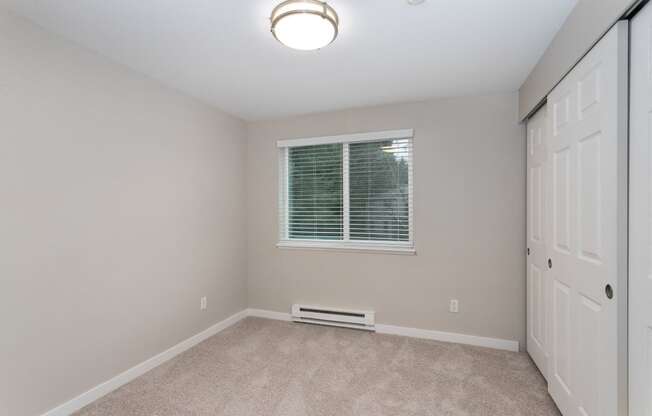 Novela Apartments Bedroom with Closet Door and Window