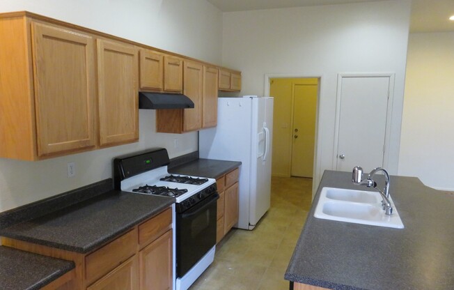Huge family room with kitchen nicely tucked in the middle.