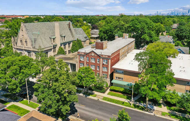 A street view of a residential area with houses and trees.
