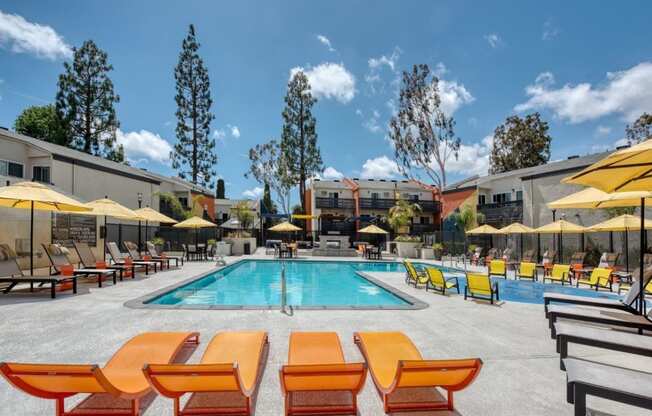 Pool deck with loungers at Horizon Apartments in Santa Ana, California