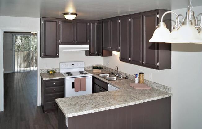 a kitchen with a sink and a mirror