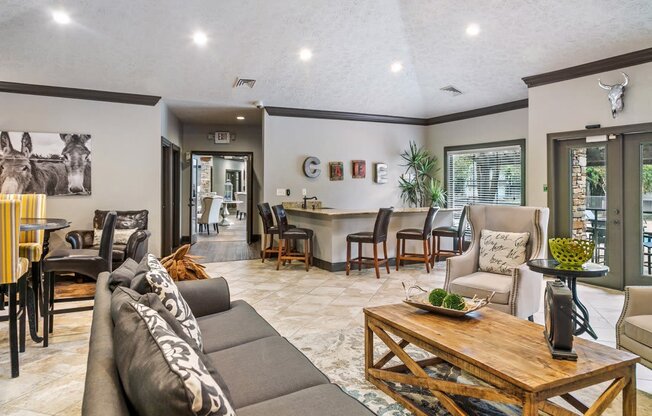 A living room with a grey couch and a wooden coffee table at Ridge Crossings Apartments, Alabama 35244