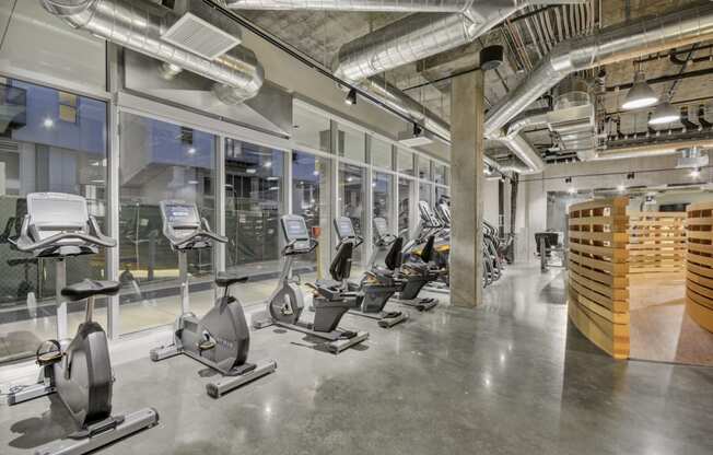 a gym with treadmills and other exercise equipment at L Seven, San Francisco, CA