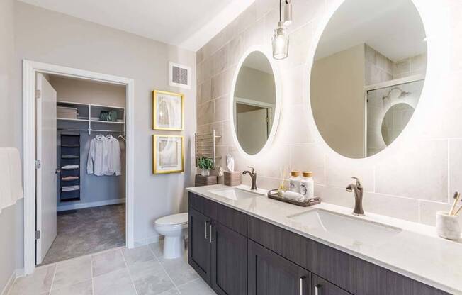 Upgraded fixtures continue into the bathrooms including dual vanities, heated towel warmers and backlit bathroom mirrors*