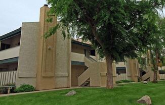 a large building with a tree in front of it