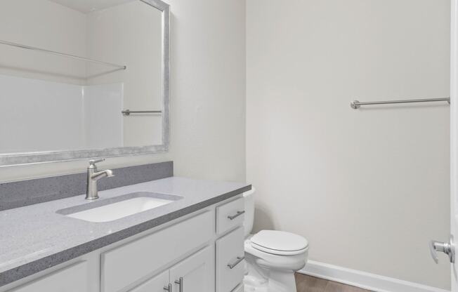 Guest Bathroom with lots of storage and a soaking tub