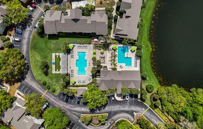an aerial view of a house with a blue cross on its roof