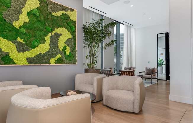 a living room with couches and chairs and a large artwork on the wall  at Cassidy on Canal, Chicago, Illinois