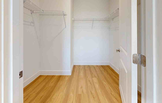Step into elegance with this expansive walk-in closet, perfect for organizing your wardrobe in style.