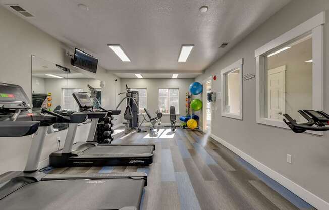 Community Fitness Center with Equipment at Landings at Morrison Apartments located in Gresham, OR.