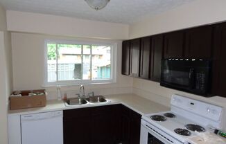 Spacious 3-Bedroom Split-Level Home with Large Deck and 2-Car Garage