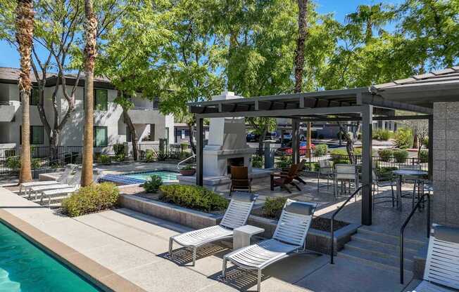 shaded, poolside lounging areas at Avora apartments