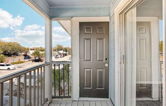 A grey door is on the left and a white door is on the right.