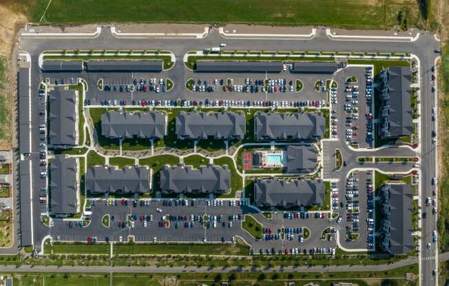 a parking lot from above with cars parked in it